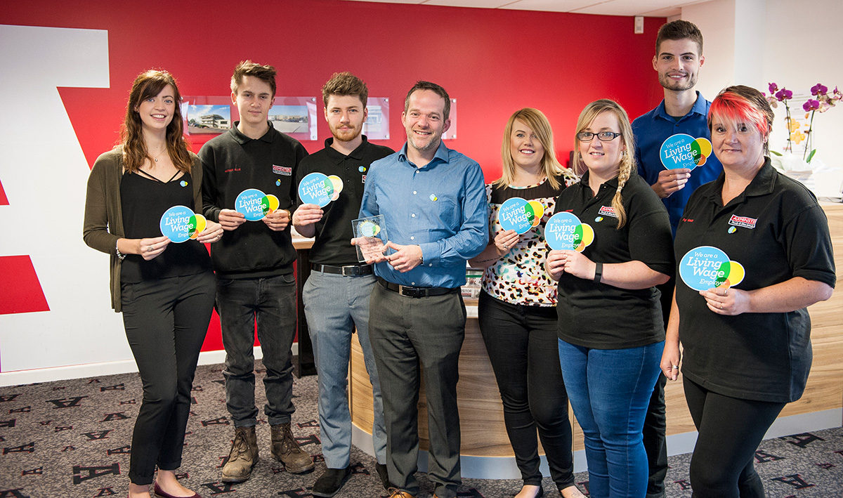 L to R: Harriet Searle, Nathan Ellis, Grant Jones, Alan Styles (Managing Director) with trophy, Maddie Edwards, Rachel Newton, Tom James and Fiona Gage.