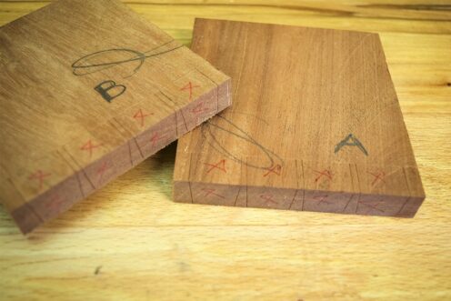 Two sections of Mahogany marked out pin boards.