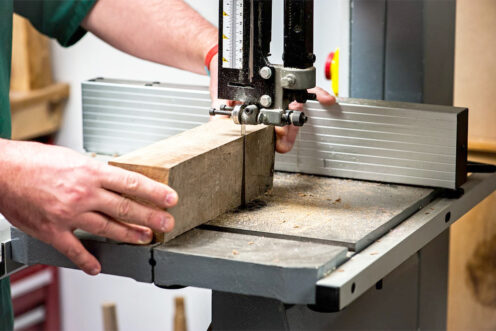 Cutting to size the top and bottom sections of the mill using a bandsaw.