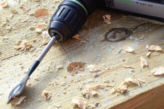 Drill the drainage holes with a 25mm flat bit