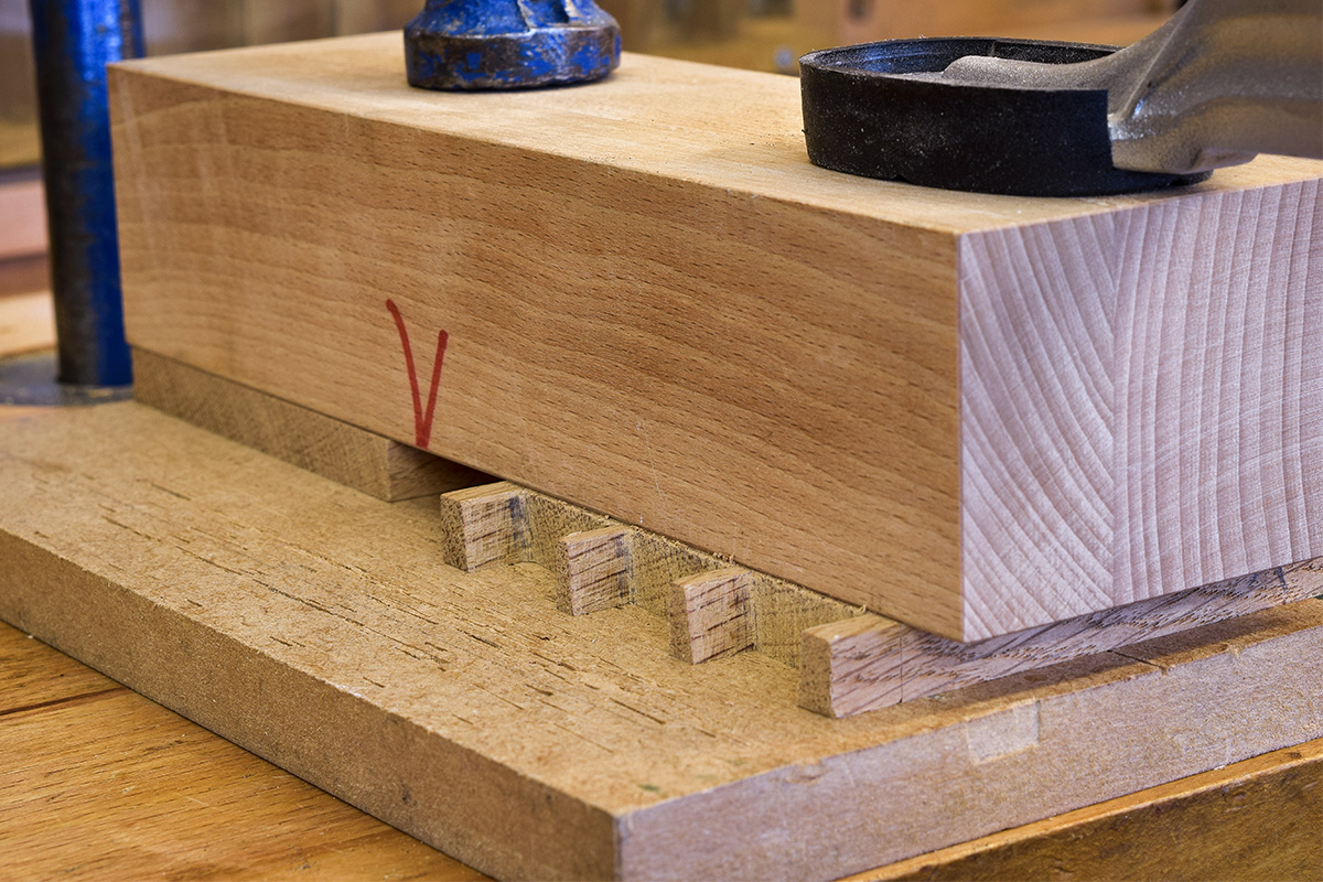 Chiseling block clamped to the workpiece