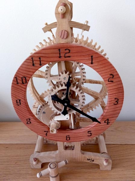 Wooden clock made from recycled Oak and Spalted Beech. Driven by a clock main spring, hand wound (Mike M)