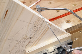 Using a coping saw, form the top of the caddy end
