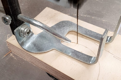Cutting the car parts with a scroll saw