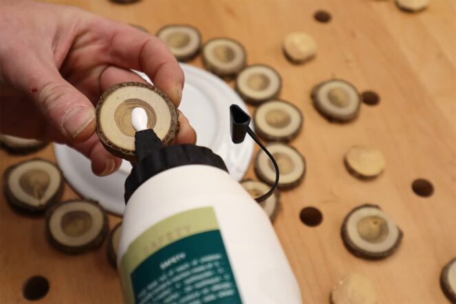 Generously apply PVA glue to the back of the rounds